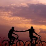 Surviving Infidelity. boy and girl cycling, caught hand